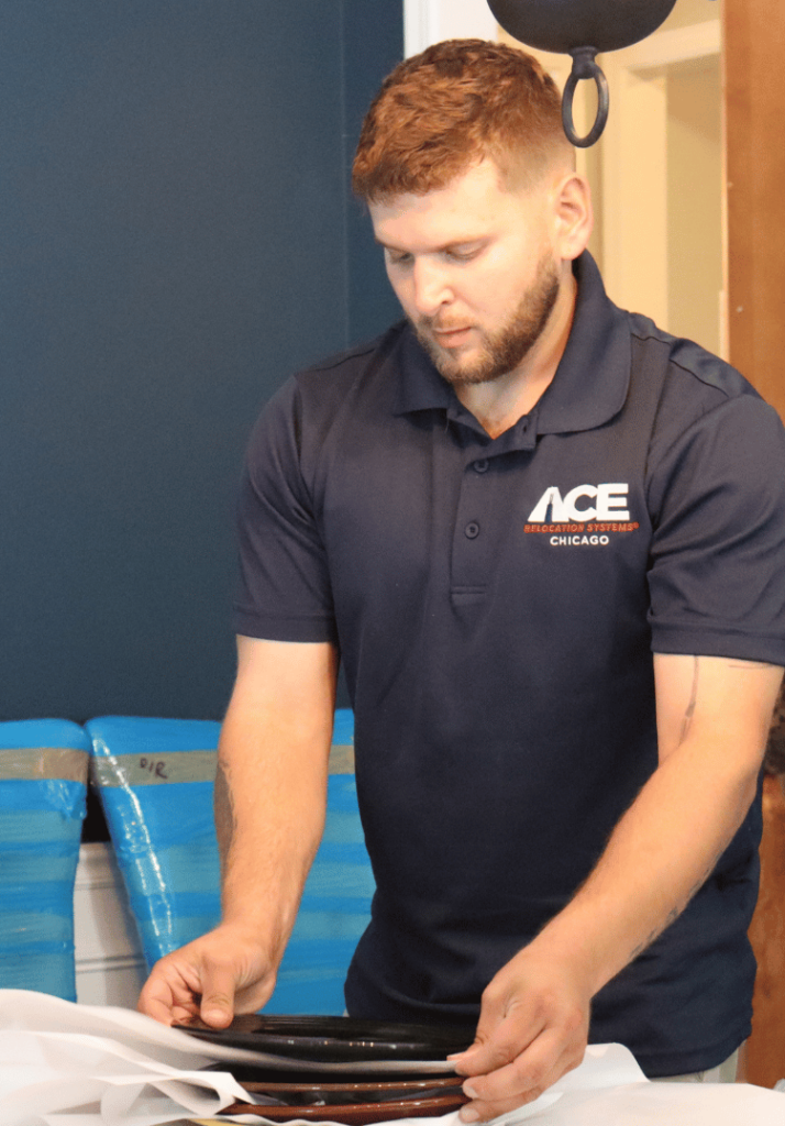 Ace Relocation professional packer wrapping dishes for a move